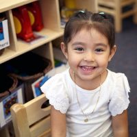 Little schoolgirl smiling at camera