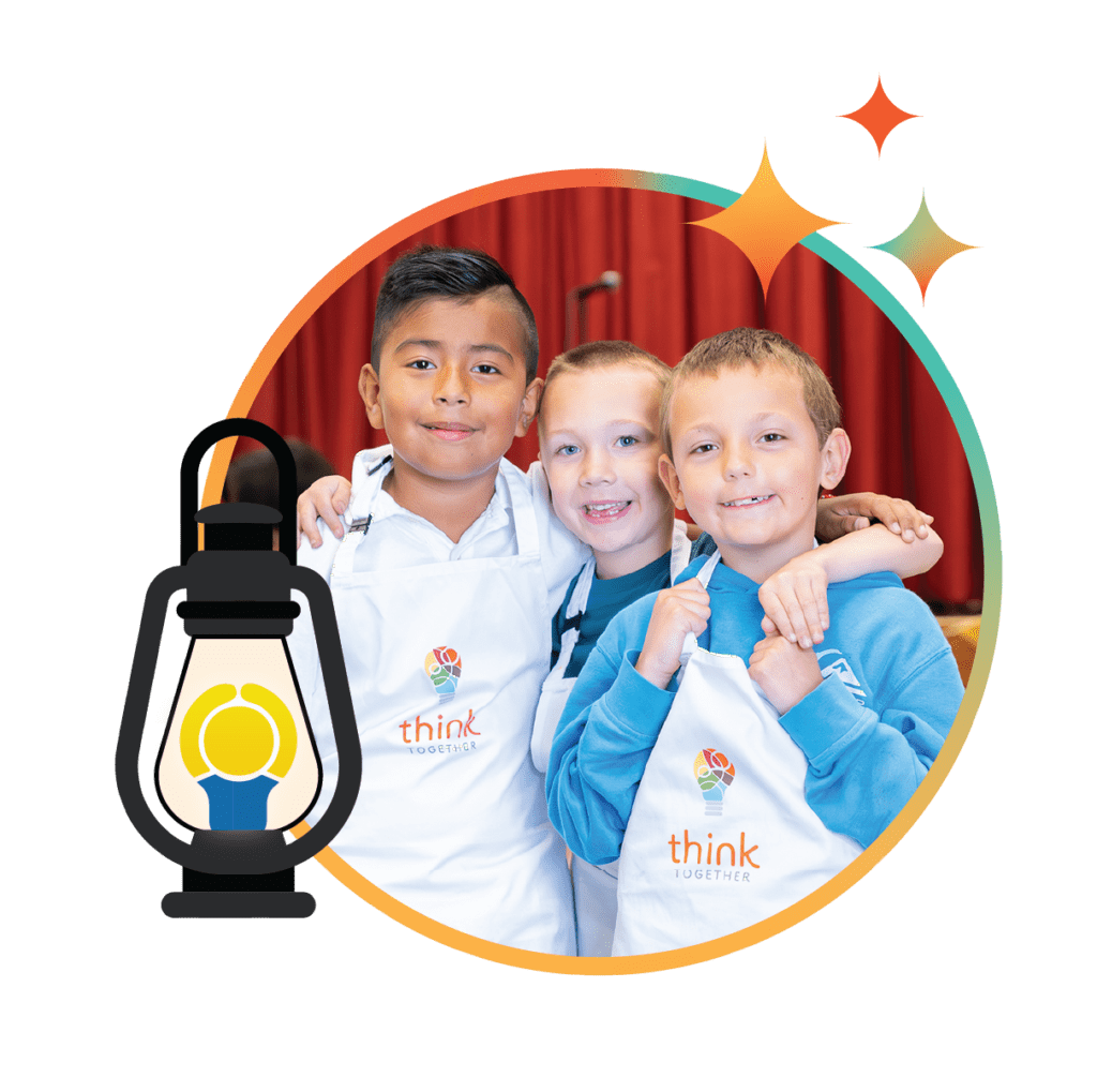 3 kids smiling for a photo with their arms around each other